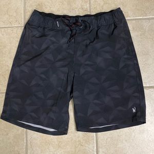 Spyder black swim trunks. Size L. Inside change pouch. Spyder logo. Drawstring.